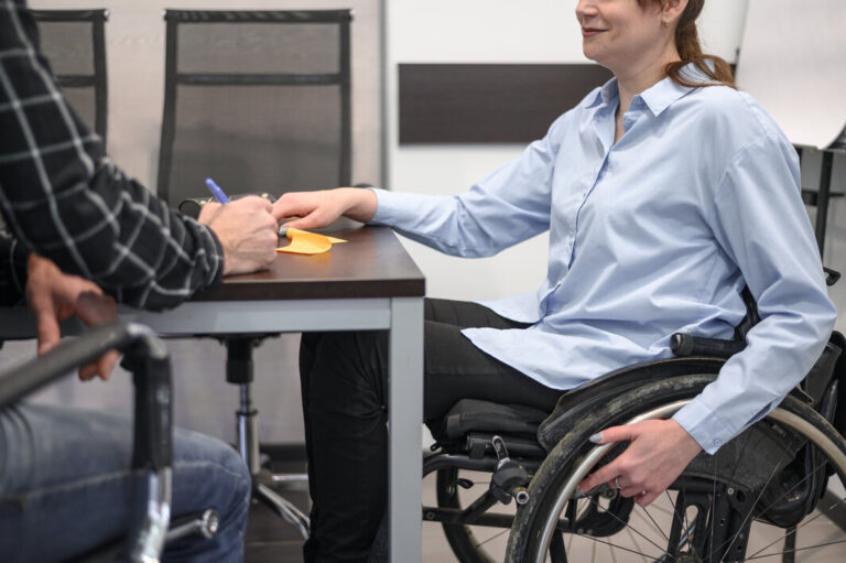 woman sitting wheelchair desk